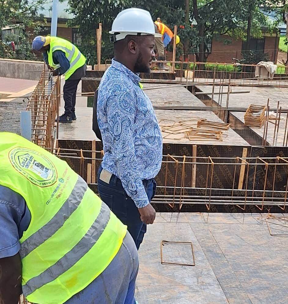 Site manager overseeing slab formwork on active construction site
