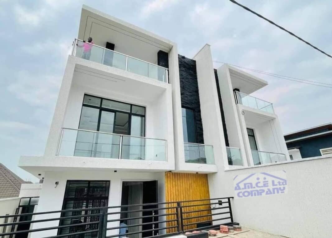 Completed modern villa with glass balconies, AMCE Ltd