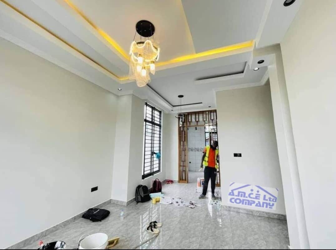 Finished living room with modern chandelier and lighting