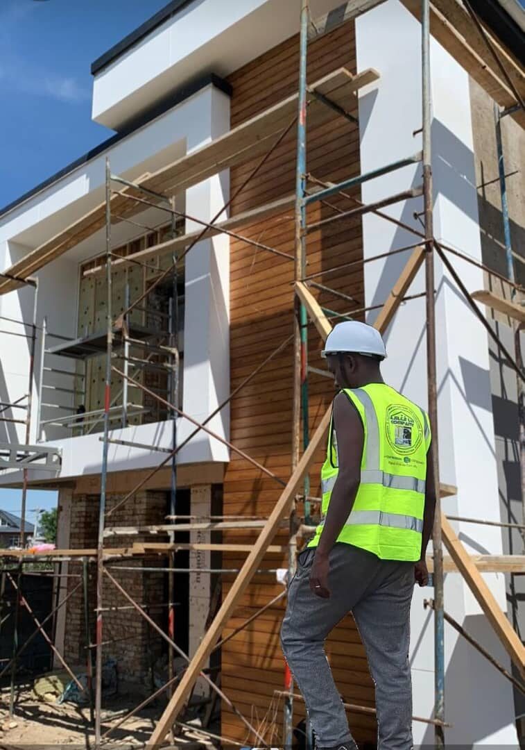 Modern villa facade under construction with scaffolding